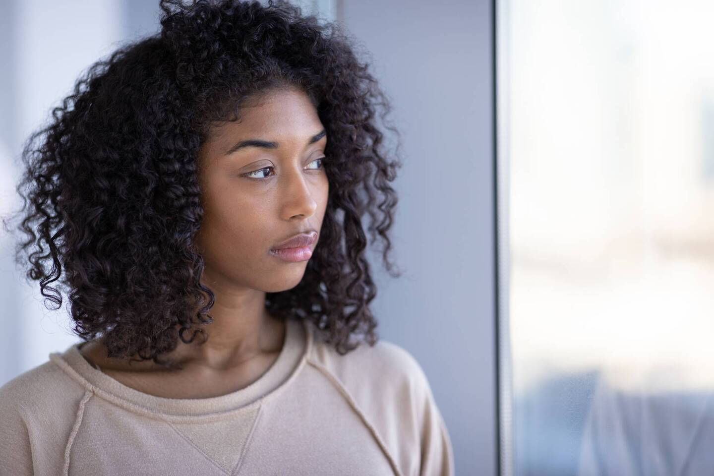 Young black woman at home sad depressed serious face portrait st