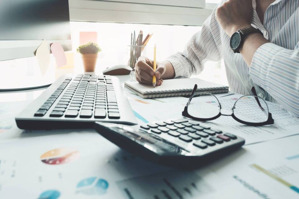Bookkeeper or financial inspector hands making report, calculati