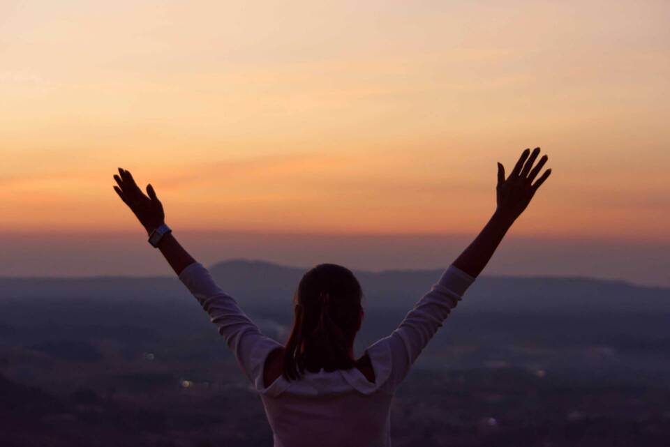 The black silhouette of behind the women raise their arms Backgr